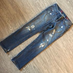 Distressed denim jeans